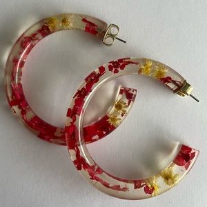 Anthropologie acrylic hoops with pink and yellow flowers inside